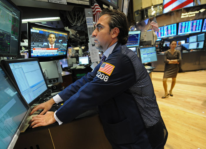 A specialist works on the floor of the New York Stock Exchange this week.