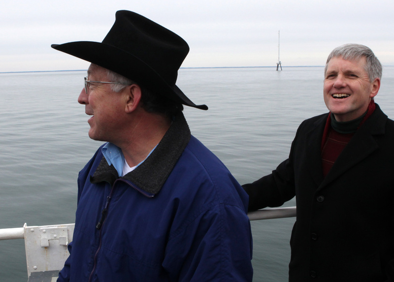 Secretary of the Interior Ken Salazar, left, and Deputy Secretary of the Interior David Hayes take a tour of Nantucket Sound last year to assess the viability of the proposed Cape Wind wind farm. Behind them is a 190-foot meteorological tower, part of the Cape Wind site.