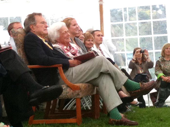 Barbara and George H.W. Bush listen to a speaker at the garden dedication ceremony in Kennebunkport today.
