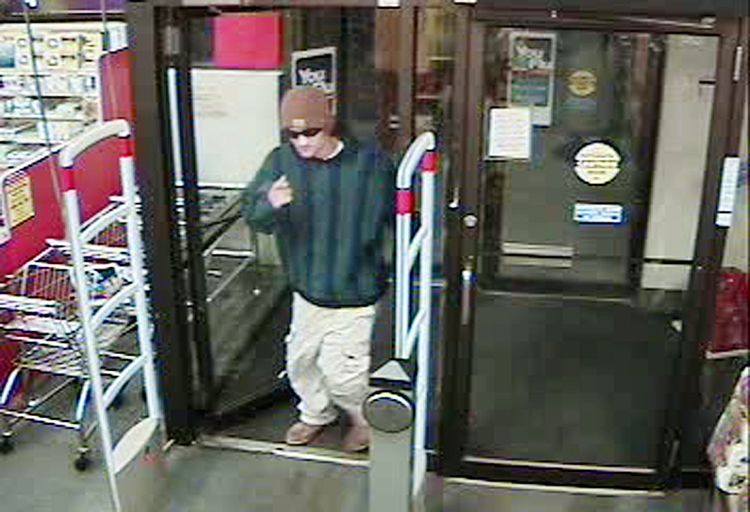 Security camera image showing the robbery suspect entering the CVS Pharmacy at 1096 Brighton Ave. in Portland.