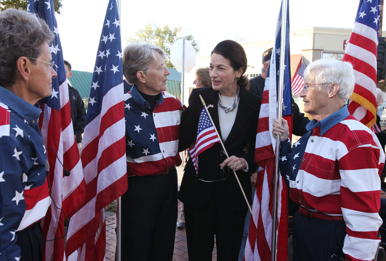 Freeport Flag Ladies Carmen Footer, left, Elaine Green, center, and JoAnn Miller, right, speak with Sen. Olympia Snowe, R-Maine, as they gather today on Main St. in Freeport, Maine to mark the 10th anniversary of 9/11. 9/11