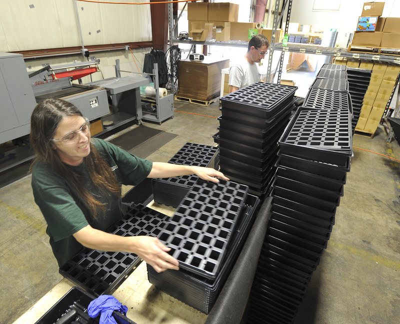 Julie Dresser assembles starter kits at Grow-Tech in 2014.