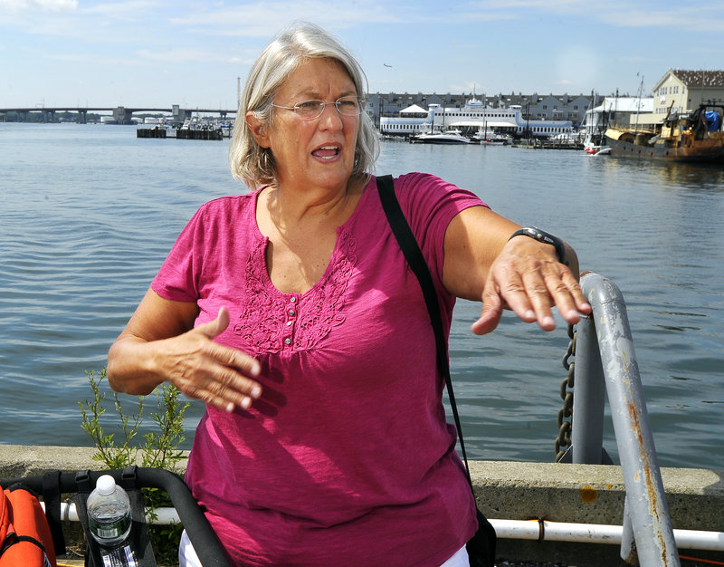 Pat Gallant-Charette, strolling the Maine State Pier with her grandchildren Wednesday, talks about her record-setting swim across the English Channel.