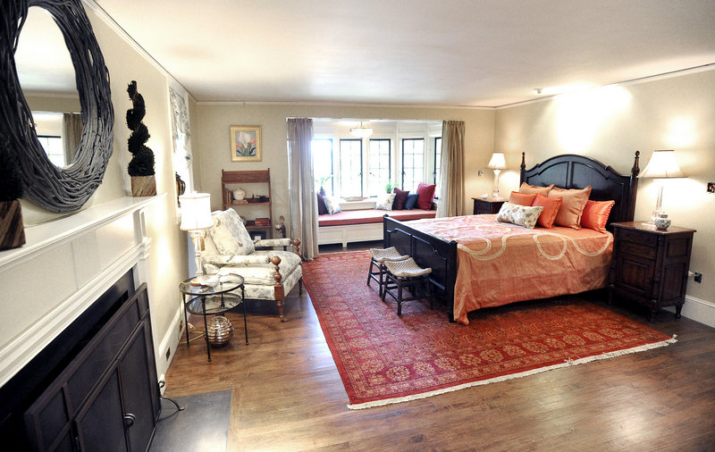 The expansive master suite has a fireplace and a window seat.