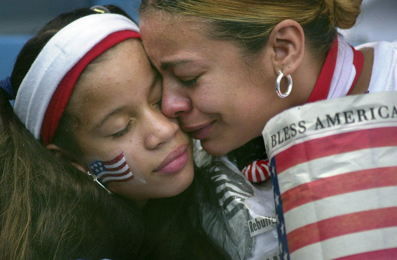 In the days after the terrorist attacks of Sept. 11, 2001, The Portland Press Herald sent columnist Bill Nemitz and photographer Gregory Rec to New York to report from the scene. This is one of the photos from that report: Frances Ortega of the Bronx hugs her daughter Quasha at the start of the "Prayer for America" ceremony at Yankee Stadium in New York on Sunday, Sept. 23, 2001.