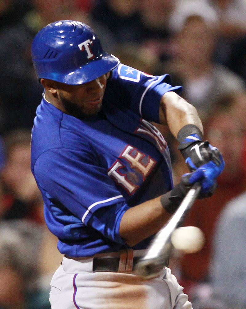 Elvis Andrus hits a two-run home run during the Rangers’ 10-0 win over the Red Sox on Friday night in Boston.