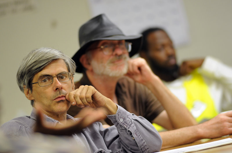 Unemployed men listen to a speaker Aug. 23 at the Philadelphia Unemployment Project. The jobless face increased hostility from conservative lawmakers, as more states cut the amount and duration of benefits, while making them harder to get and easier to lose.