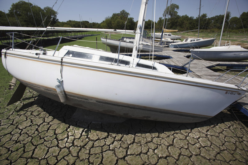 Sailboats sit on the parched bed of Benbrook Lake in Benbrook, Texas, during extreme drought conditions last month. Weather extremes across the nation in 2011 have included the hottest month ever recorded by any state: July in Oklahoma. The nation has had a record 10 weather catastrophes costing more than $1 billion each.