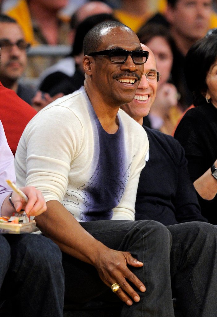 Actor Eddie Murphy, seen at a Lakers-Mavericks game during the NBA playoff series in May, made a surprising agreement to host the 84th Academy Awards ceremony this year.