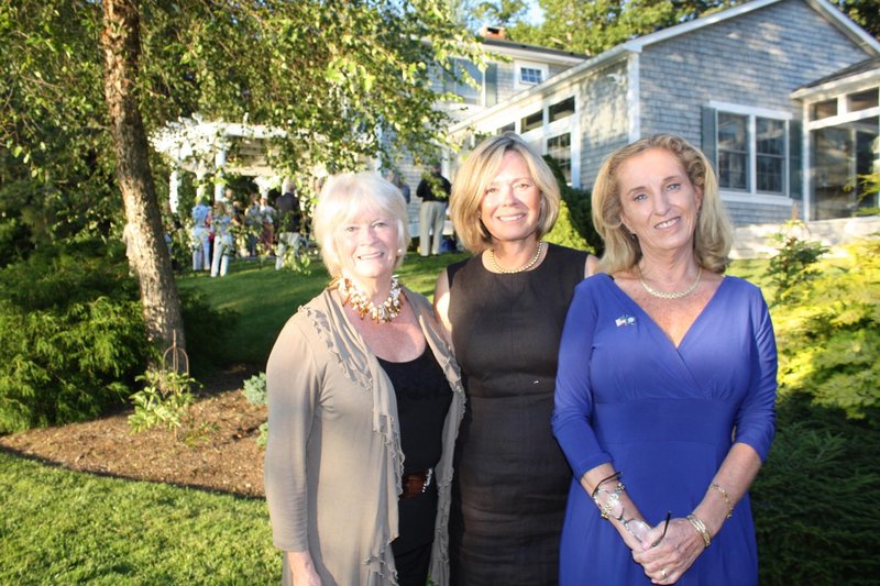 Carol Stratton, who helped select Maine art to be displayed in an embassy overseas, Cynthia Watson, who helped select the art and hosted the party celebrating the effort, and U.S. Ambassador to Gambia Pamela A. White.