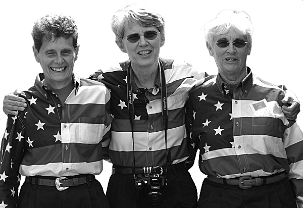 It’s September 2010. I’m standing on Main Street in Freeport with Elaine Greene, Carmen Footer and JoAnne Miller, better known as the Freeport Flag Ladies.