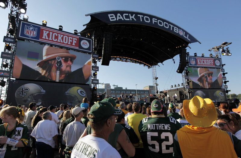 Kid Rock performs during a kickoff concert on Thursday before a game between the Green Bay Packers and the New Orleans Saints in Green Bay, Wis. The football season supports about 110,000 jobs in NFL cities.