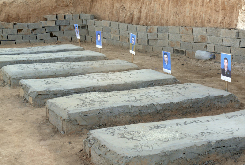 Tombs contain bodies that were reburied after being unearthed from a mass grave of 35 men in Galaa. Some 4,000 people remain missing across Libya.