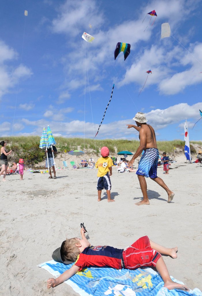 Hubert Pepin, 4, of Quebec takes it easy while flying his kite.