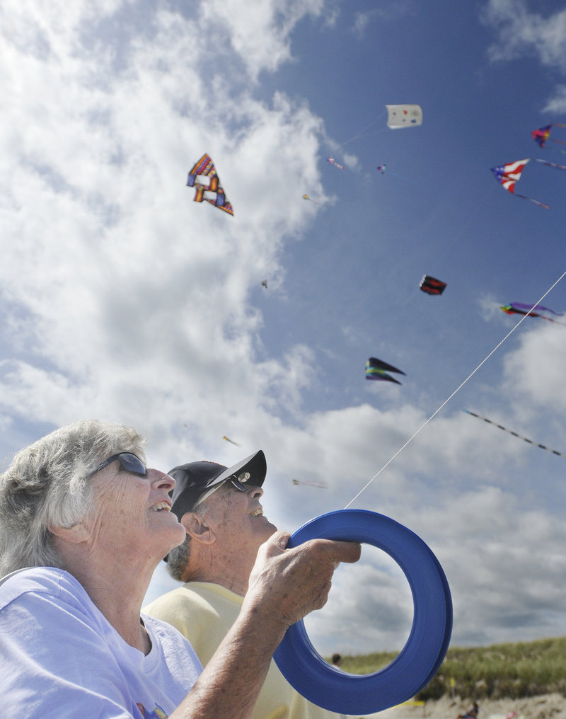 Jane and Ben Clark of Michigan watch their kite as it dances above Ogunquit Beach.
