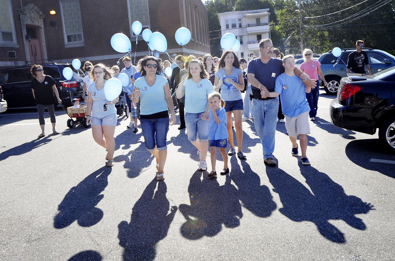 Participants set out on a walk to benefit the family of Liam Mahaney on Saturday in Biddeford.