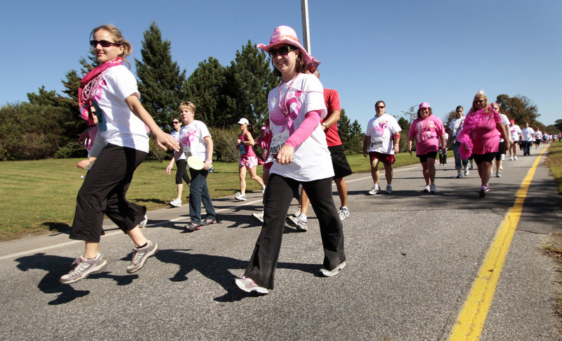 Hundreds of participants parade in pink on Baxter Boulevard during the Race for the Cure along Back Cove on Sunday.