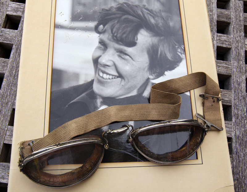 An original personal photo of Amelia Earhart dated 1937, along with goggles the aviator wore, are among items that raised more than $31,000 at auction.
