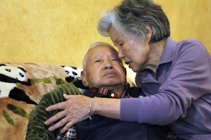 Shou-Mei Li cares for her husband, Hsien-Wen Li, an Alzheimer’s patient, in their San Francisco home. About 5.4 million Americans have Alzheimer’s or similar dementia.