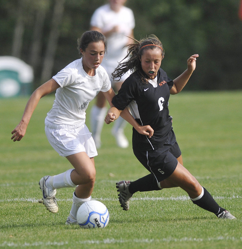Sofia Canning of Waynflete, left, competes for the ball with Hannah Twombly of North Yarmouth Academy during their Western Maine Conference game Wednesday.