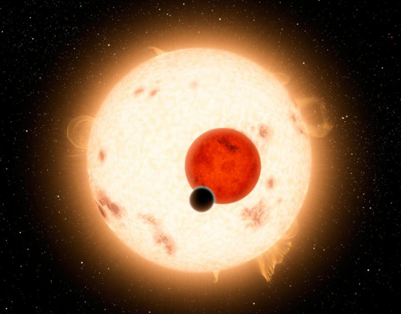 Artist’s depiction shows the planet Kepler 16B, a world where two suns set over the horizon instead of just one.