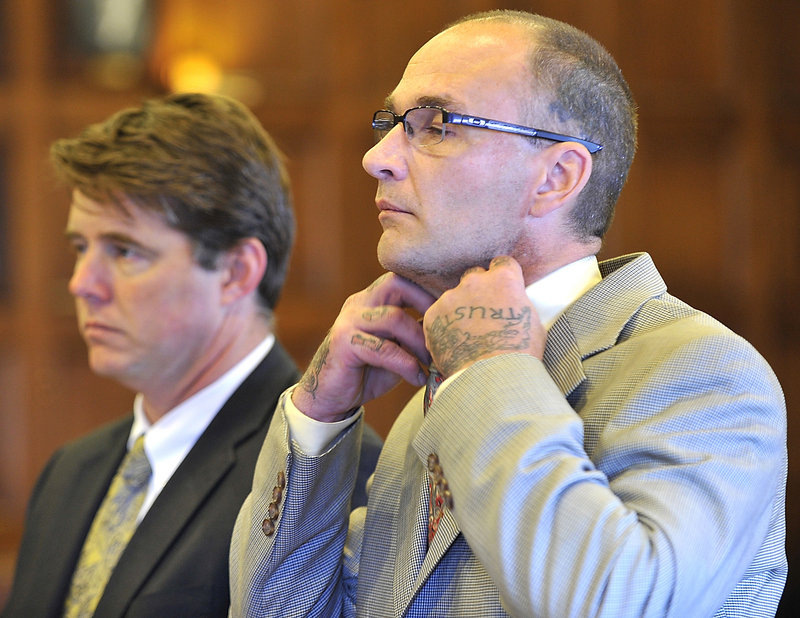 Joseph Green adjusts his collar as he listens to Justice Roland Cole give his sentence in Cumberland County Superior Court on Friday. At left is his attorney, Jon Gale.