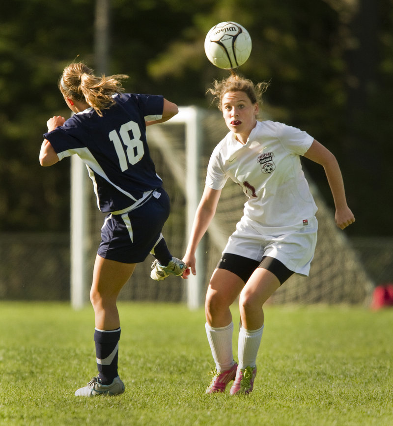 Claudia Lockwood, left, of Yarmouth and Aubrey Pennell of Freeport battle for possession during Yarmouth's 2-1 victory Friday in Freeport.
