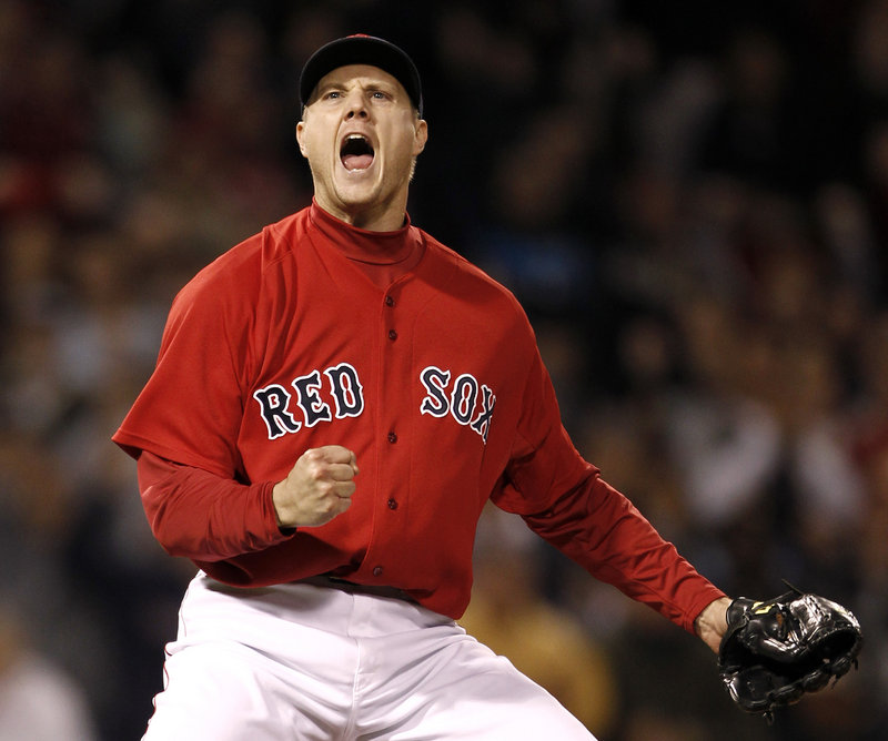 Jonathan Papelbon lets out a roar after striking out Tampa Bay’s Evan Longoria to end Boston’s 4-3 victory Friday night at Fenway Park.