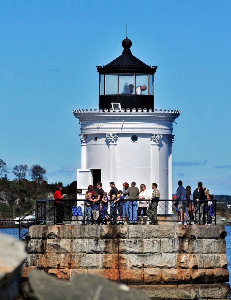 Visitors walk around Bug Light on Saturday during Open Lighthouse Day.