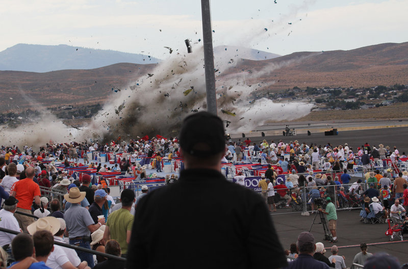 A P-51 Mustang, a World War II-era fighter plane, crashes into the edge of the grandstands at the National Championship Air Races on Friday in Reno, Nev. At least nine people died, including Jimmy Leeward, the veteran pilot of the plane.