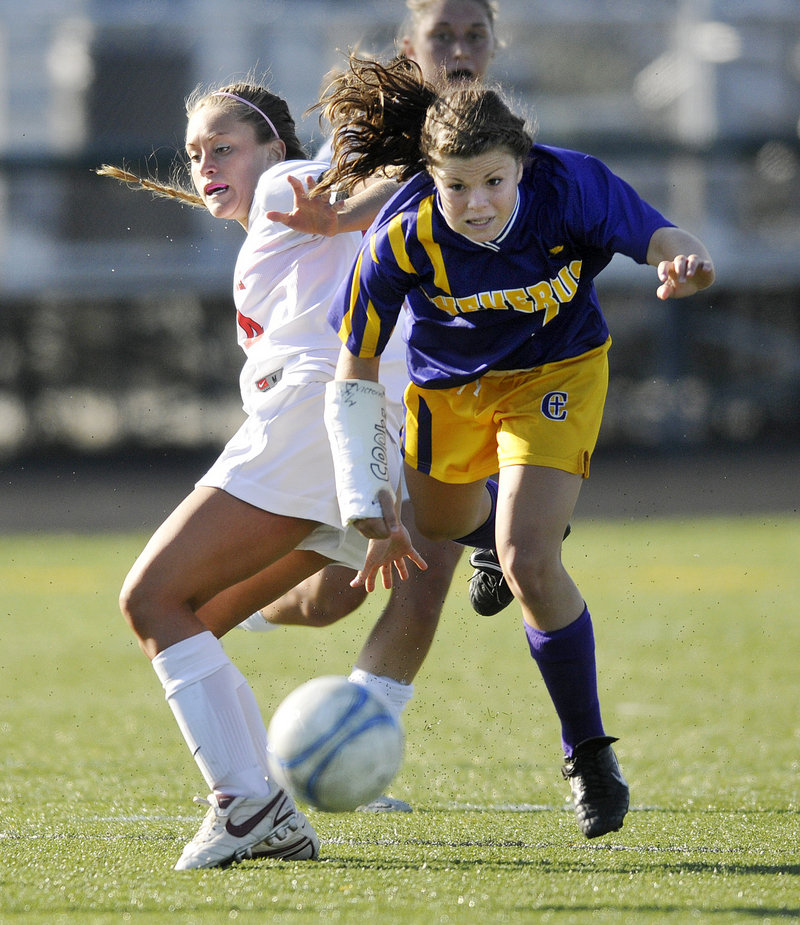 Abby Maker of Cheverus attempts to keep her balance after colliding with Emily Howes of Scarborough.