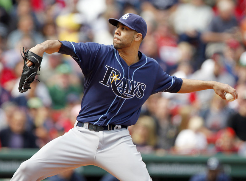 David Price was hit in the shoulder by a line drive but the Rays got an out on the play. Price was taken to a hospital for tests, which the team said were negative.