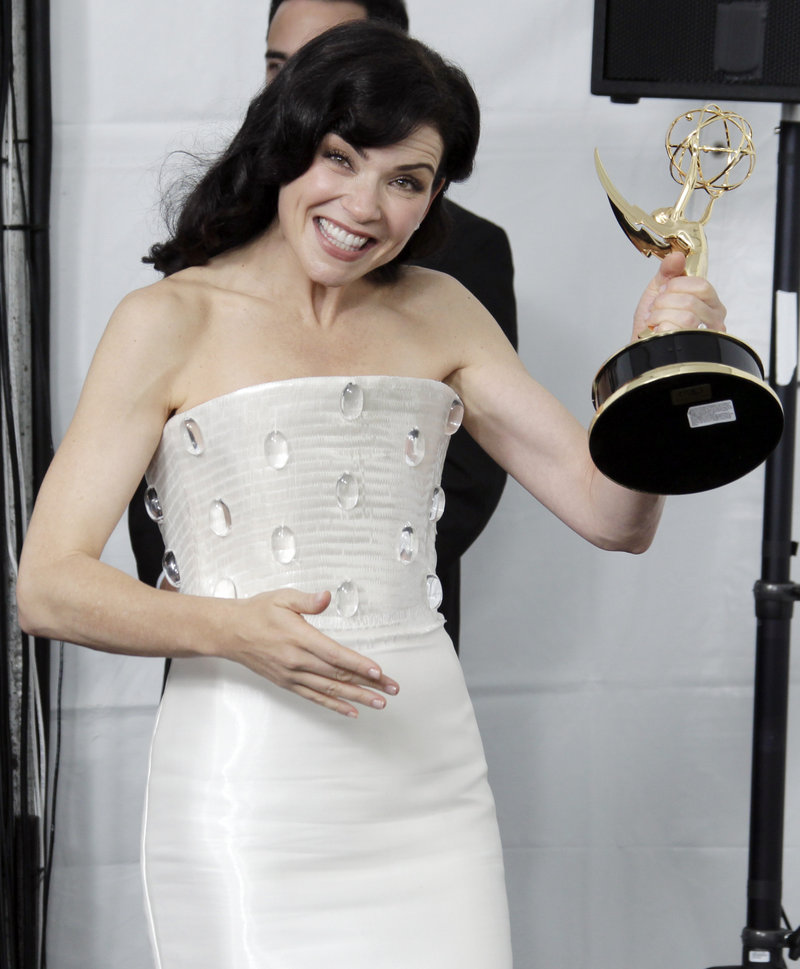 “The Good Wife” cast member Julianna Margulies shows off her Emmy for best lead actress on Sunday.