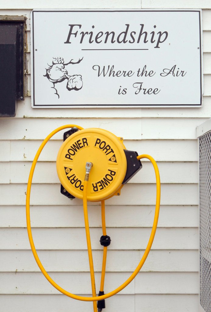 A sign outside Archie Wallace’s store in Friendship lets visitors know they can fill up their car or bike tires for free.