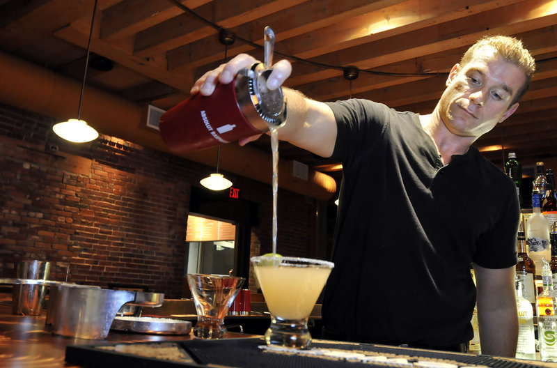 Matt Mullen, the bar manager at Gauchos Brazilian Steakhouse on Commercial Street, pours a Grand Martini, made with equal parts Jose Cuervo and Cointreau and a splash of Grand Marnier.