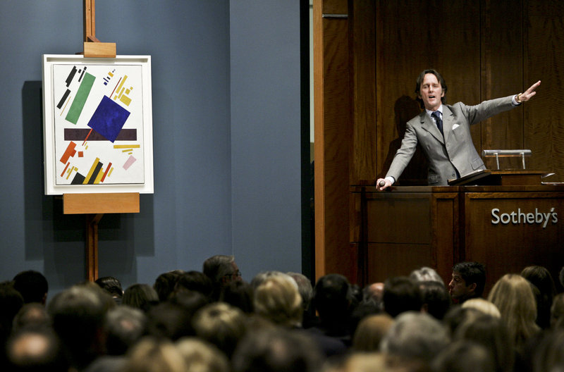 An auctioneer takes bids from collectors on a painting at Sotheby’s auction house in New York, a frequent destination for those who have made it financially. The United States leads the world in millionaires with an estimated 5.2 million of them in 2010, or nearly one in every 20 households.