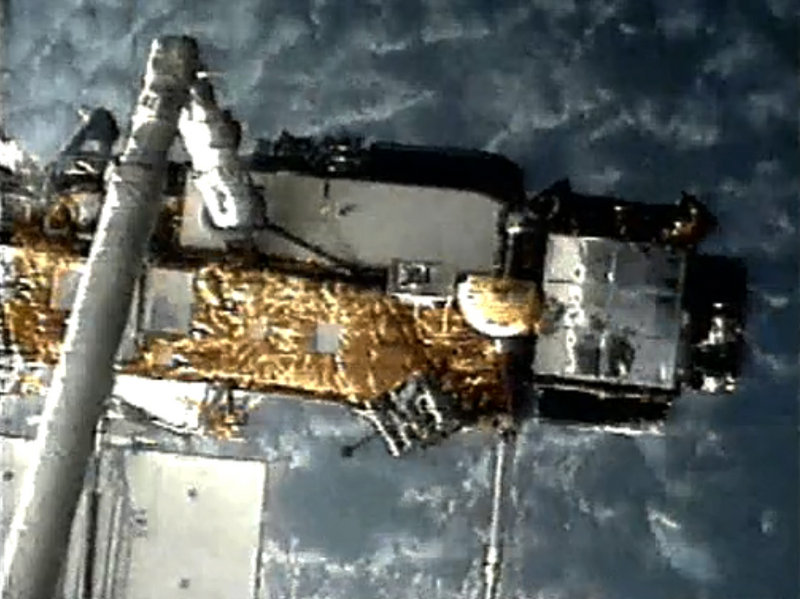 An image from NASA shows the Upper Atmosphere Research Satellite when it was deployed by space shuttle Discovery in 1991. Scientists say pieces of the 35-foot-long satellite will rain down at the end of the week.