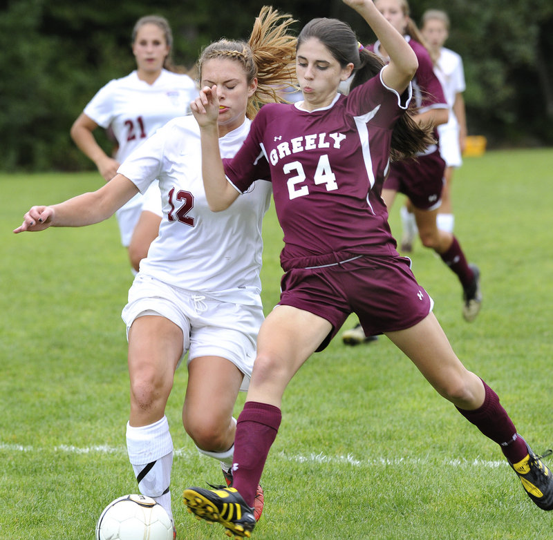 Leah Young of Greely attempts to knock the ball away from Jess Hench of Freeport during Greely’s 3-0 victory Tuesday at Freeport High. The Rangers improved to 5-1. Freeport is 3-4.