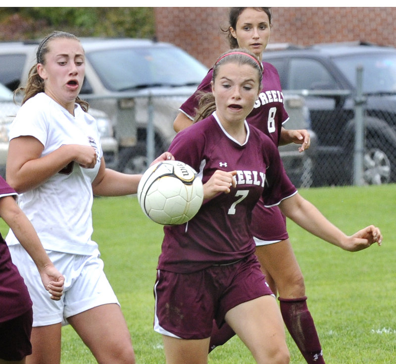 Gabby Morris of Greely looks to get the inside track to the ball ahead of Helen Humphrey of Freeport in their Western Maine Conference girls’ soccer game.