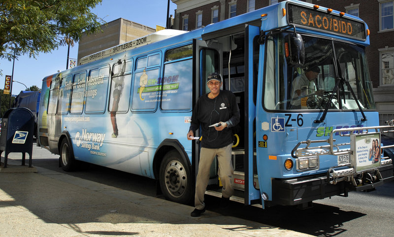 A man exits the Zoom bus at Portland City Hall on Wednesday. Ridership on the service is up overall, but some routes – especially Sundays and nights – have just two to five passengers.