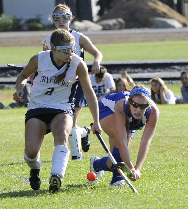 Christina DiPietro of Fryeburg Academy, left, competes for the ball with Megan Fortier of Falmouth during Fryeburg’s 4-1 victory Wednesday in a game matching the top two teams in Western Class B field hockey.
