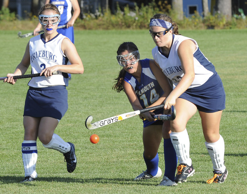 Laura Lewis of Fryeburg Academy, right, and Mikey Richards of Falmouth have their eyes on the ball Wednesday. Fryeburg came away with a 4-1 victory.
