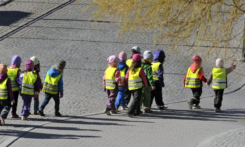 Children go for a walk at a day-care center in Stockholm. Some day-care centers in Sweden have started using electronic tracking devices to keep tabs on children during excursions