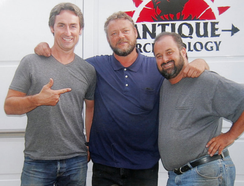 Mario Binette, center, says “American Pickers” hosts Mike Wolfe, left, and Frank Fritz were “just as crazy and nutty as they are on TV” when they visited his business in Arundel last week.