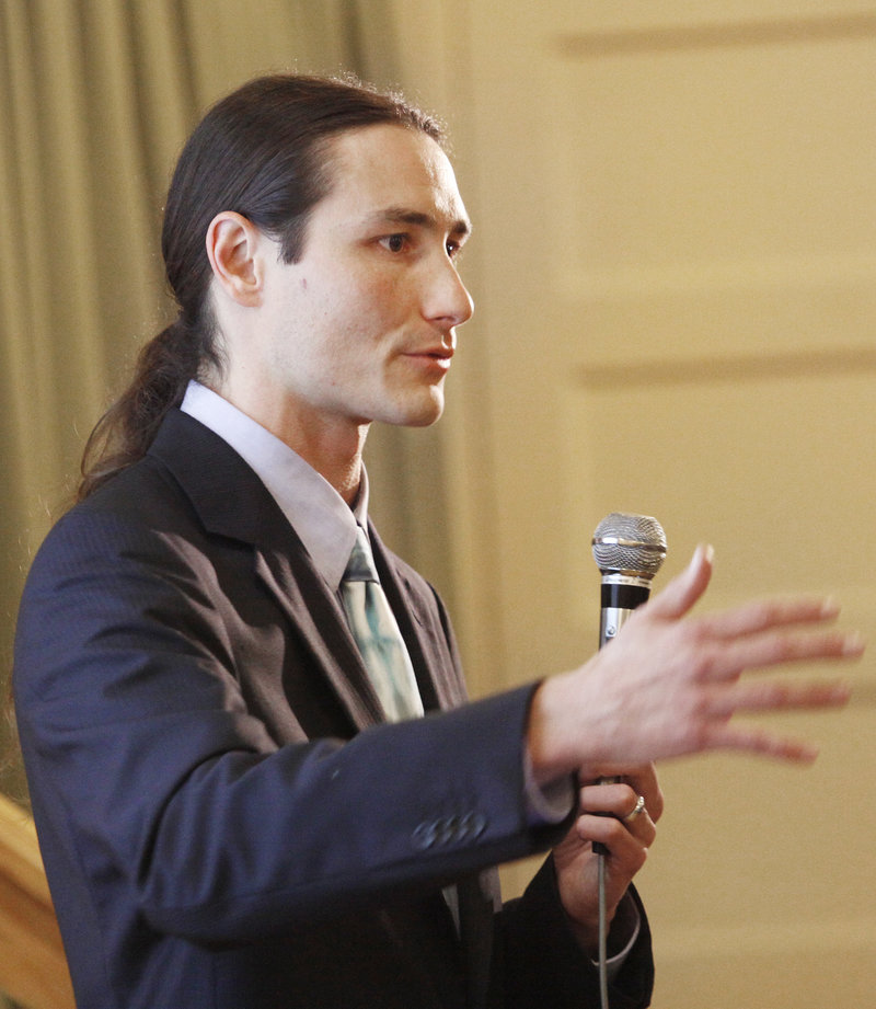 Dr. Dustin Sulak, who operates a medical marijuana practice through Integr8 Health LLC of Falmouth, speaks to more than 250 people at an educational forum Thursday at the Woodfords Club in Portland. Sulak talked about the drug’s benefits and potential uses.