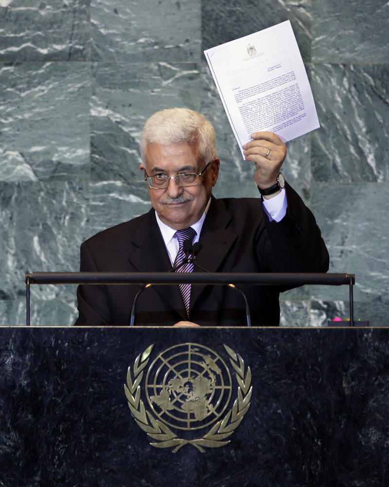 Palestinian President Mahmoud Abbas displays a letter seeking recognition of Palestine as a state during his address to the United Nations General Assembly on Friday.