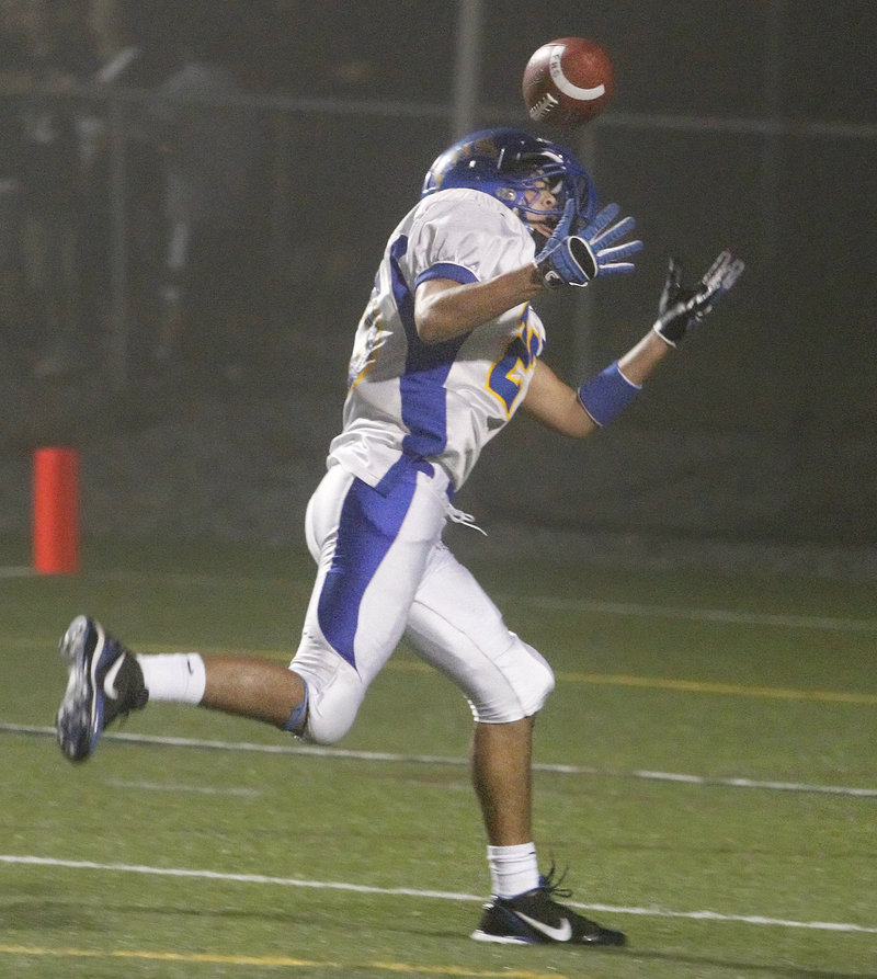 Alex Derhagopian bobbles the ball before making the catch for a touchdown on Falmouth’s second play from scrimmage, the Yachtsmen’s only points in Cape Elizabeth’s 28-6 victory.