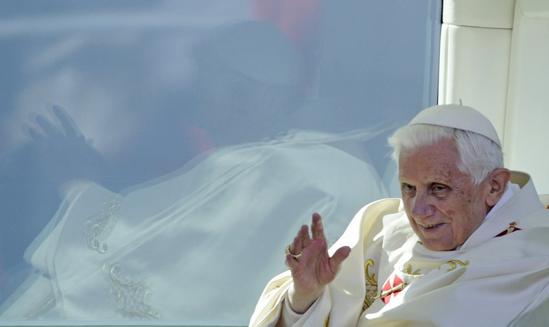 Pope Benedict XVI waves from his popemobile as he leaves the open-air Mass he celebrated in Erfurt, Germany, Saturday.