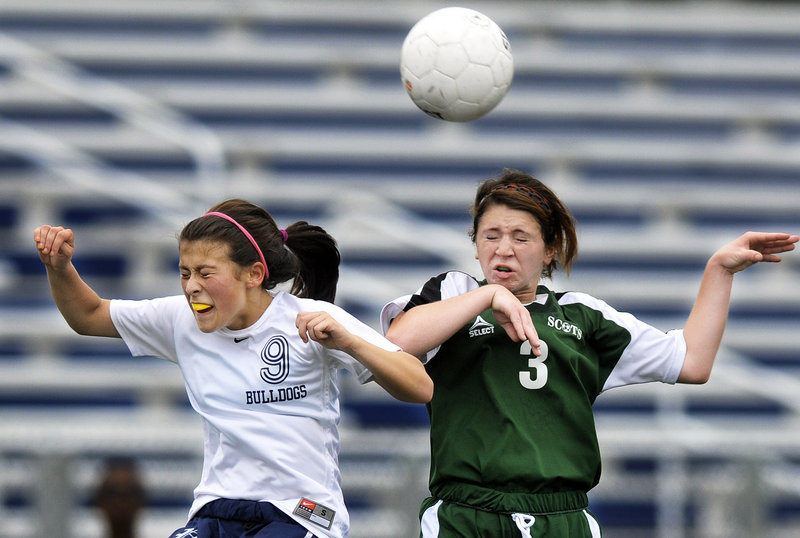 Rachel Glover, left, of Portland and Riley Kirk of Bonny Eagle compete for a header Saturday during Bonny Eagle's 2-1 victory in a schoolgirl soccer game at Fitzpatrick Stadium.