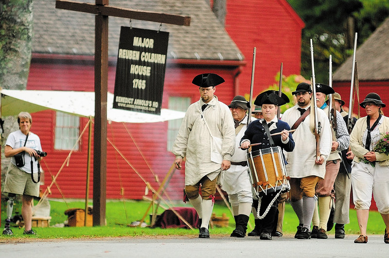 Drummer Katherine LaFlamme of Lisbon leads re-enactors in Pittston on Saturday. The group marked the anniversary of Benedict Arnold’s arrival at Maj. Reuben Colburn’s house.